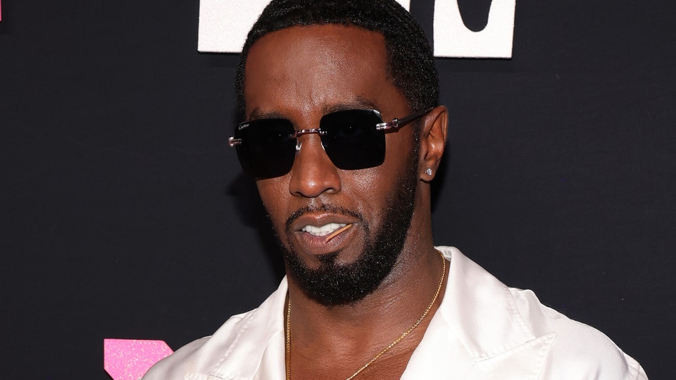 Sean "Diddy" Combs wears a white shirt on the red carpet