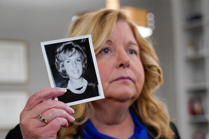 Nassau County District Attorney Anne Donnelly holds a photo of Diane Cusick