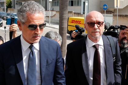 Paul Haggis arrives with his lawyer at Brindisi law court in southern Italy