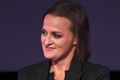 Elisabeth R. Finch sits on stage during a panel