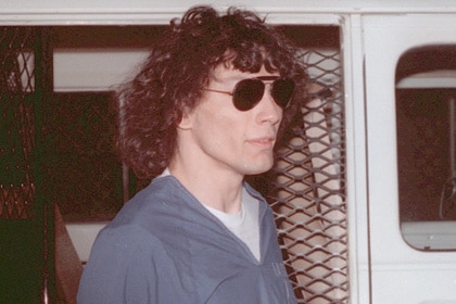 Richard Ramirez wears sunglasses outside of a prison van