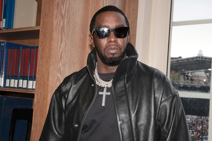 Sean "Diddy" Combs wears a leather jacket and sunglasses