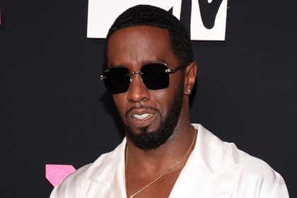 Sean "Diddy" Combs wears a white shirt on the red carpet