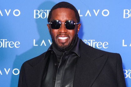 Sean "Diddy" Combs smiles on the red carpet at his birthday party