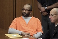 Anthony Sowell sits in a prison uniform in court.