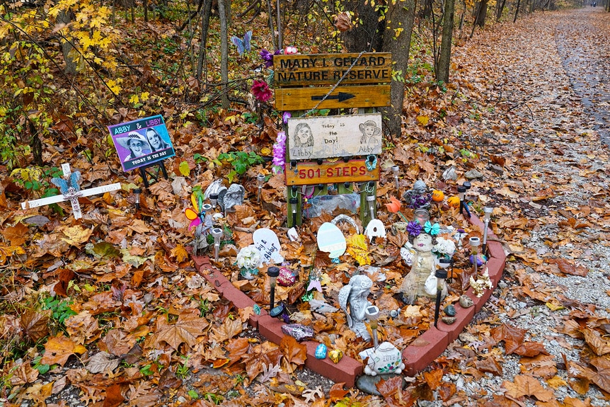 A memorial for Abigail Williams and Liberty German in a pile of leaves