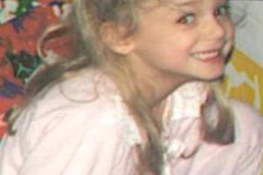 JonBenet Ramsey smiles in a pink nightgown